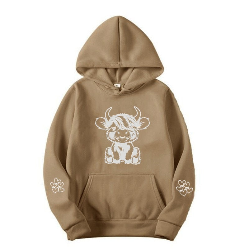 Women's hooded sweatshirt with charming cow motif and practical kangaroo pockets Lisslune