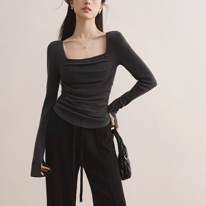 Women's fitted top with elegant gathering effect