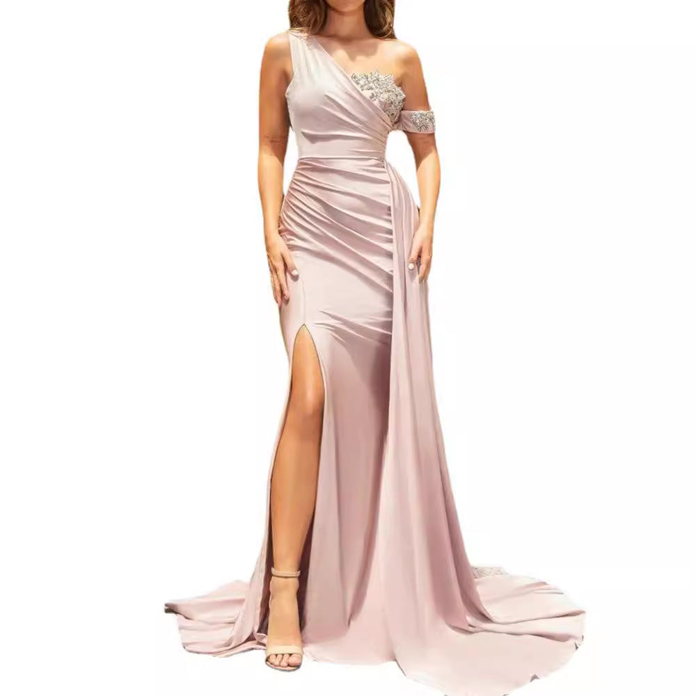 Ladies elegant evening dress with asymmetrical cut and shimmering accents