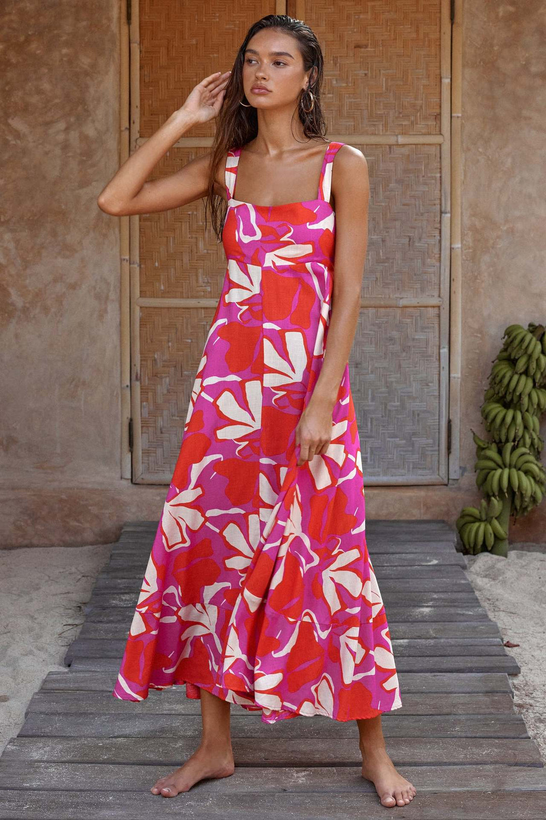 Women's maxi dress with vibrant floral design and flared skirt
