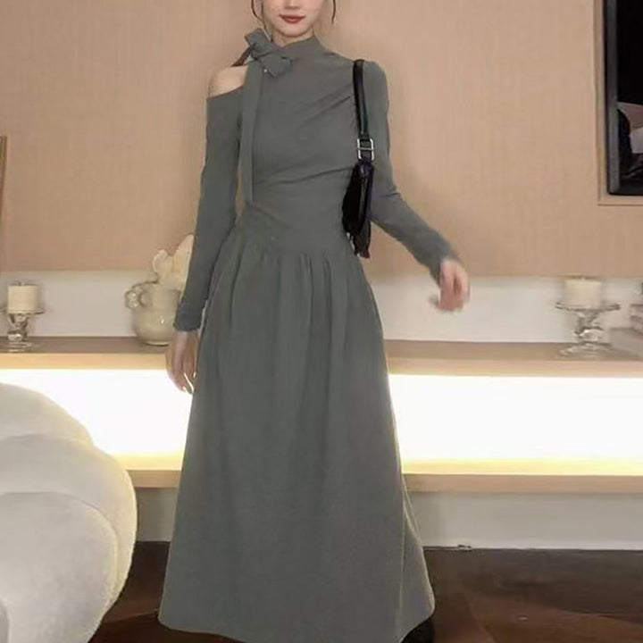 Women's dress with asymmetric neckline and elegant bow design