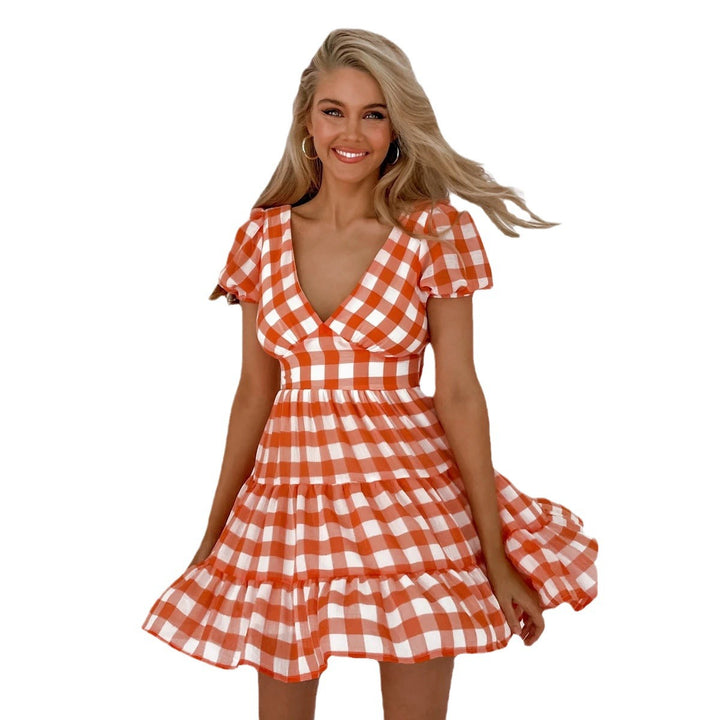 Women's casual dress with voluminous puff sleeves and playful hem Lune London