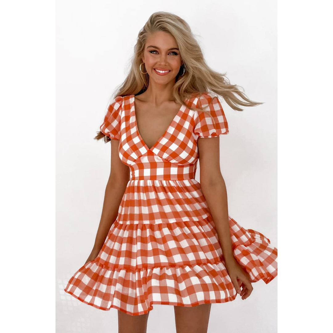 Women's casual dress with voluminous puff sleeves and playful hem Lune London