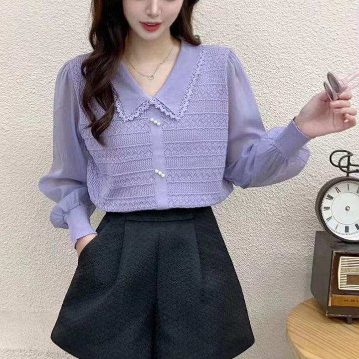 Women's blouse with lace collar and decorative buttons