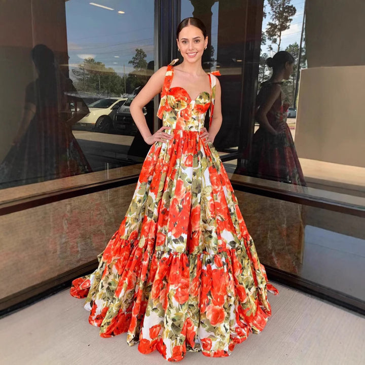 Ladies festive maxi dress with floral ruffle details and swinging skirt