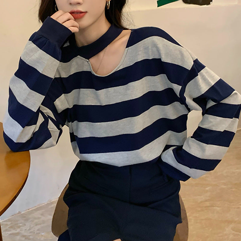 Women’s long sleeve shirt with modern stripes and an elegant neckline