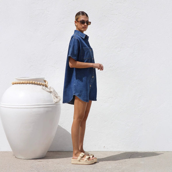 Women’s denim shirt dress with short sleeves and practical pockets