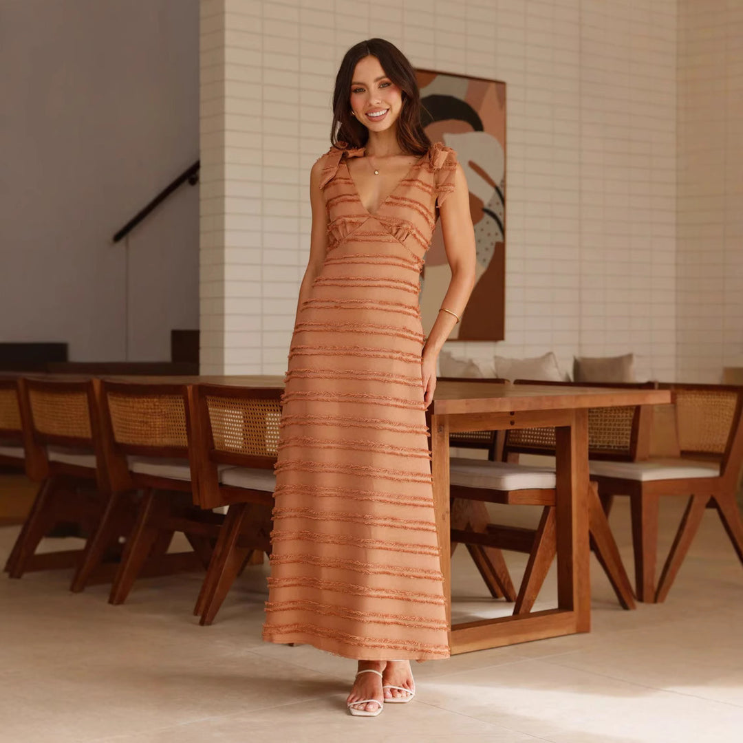 Ladies maxi dress with elegant draping design and ruffle accents