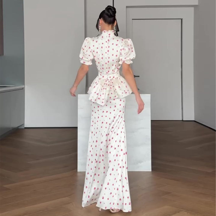 Women's maxi dress with romantic puff sleeve design and playful ruffle hem