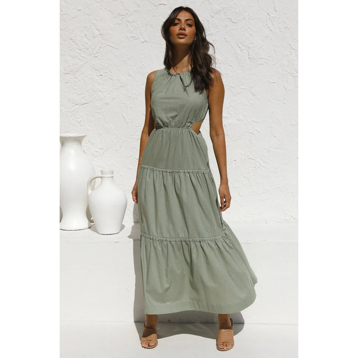 Women’s long sleeve maxi dress with playful side cutouts and flowing skirt Lune London