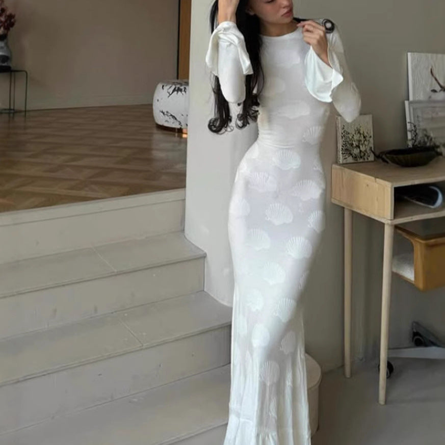 Women's form-fitting long dress with stylish shell design and elegant sleeve finish
