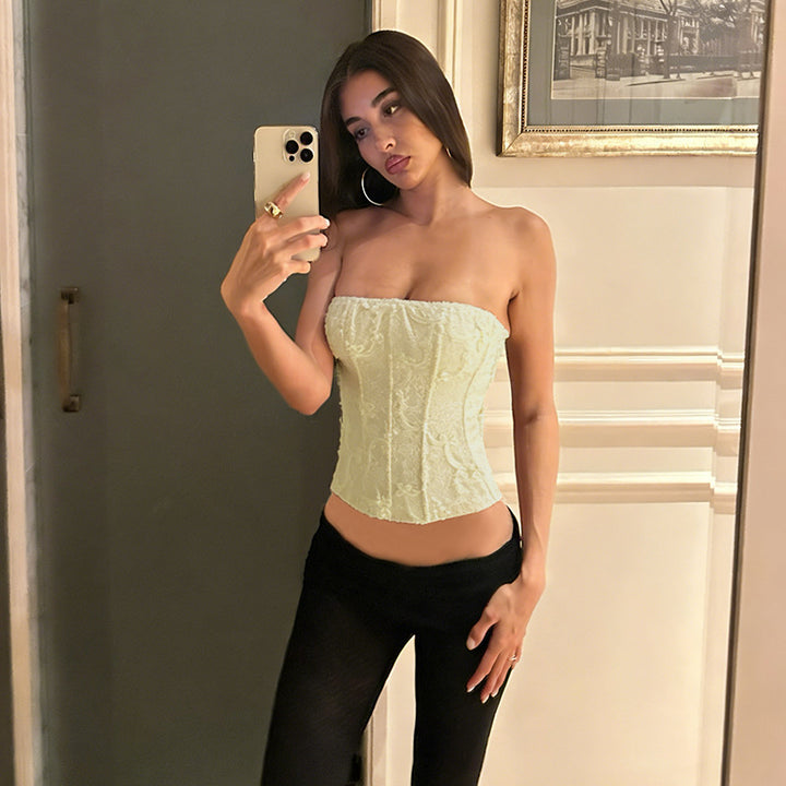 Women's corset top with intricate lace pattern and tailored fit