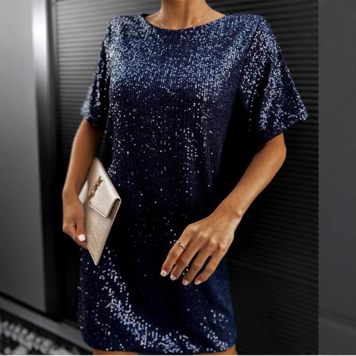 Women's festive cocktail dress made of sparkling material with a light A-line cut