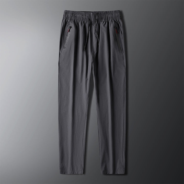 Men's sporty jogging pants with elastic waistband and side zipper Lisslune