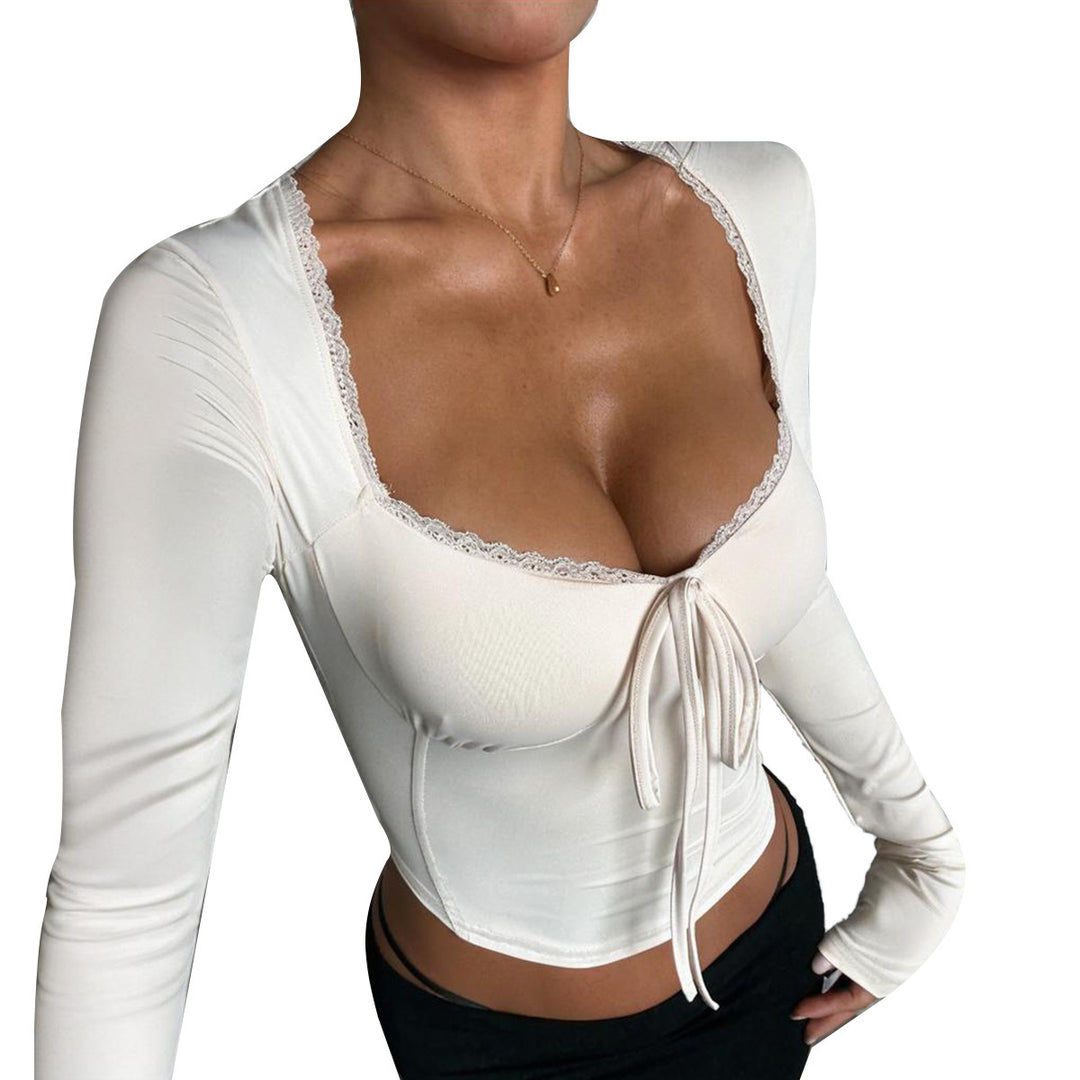 Women's long-sleeved crop top with sophisticated tie and elegant neckline