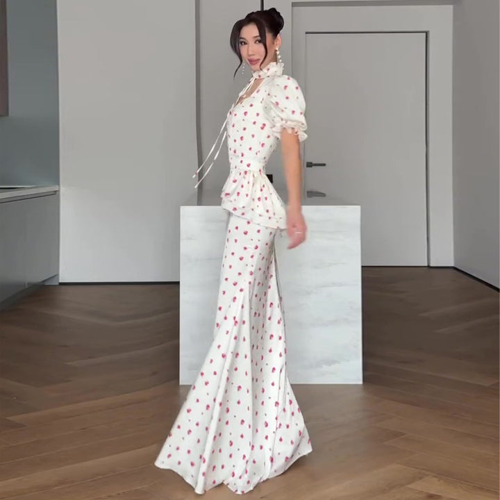 Women's maxi dress with romantic puff sleeve design and playful ruffle hem