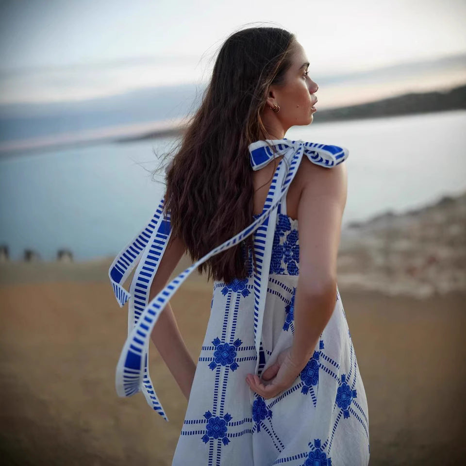 Women's maxi dress with playful check pattern and innovative strap details