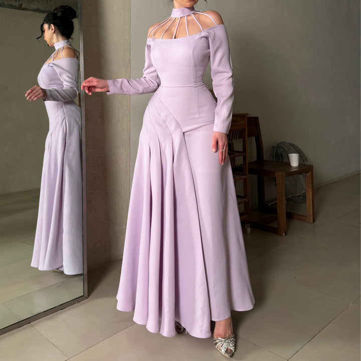 Ladies elegant evening dress with strategic cut-outs and flowing skirt