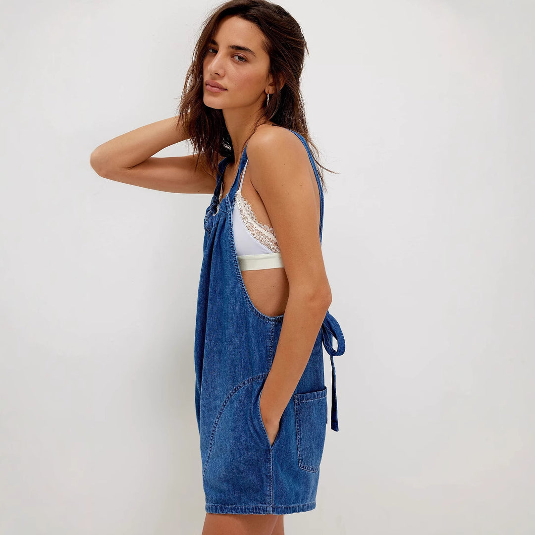 Women's denim jumpsuit with playful cut and adjustable straps