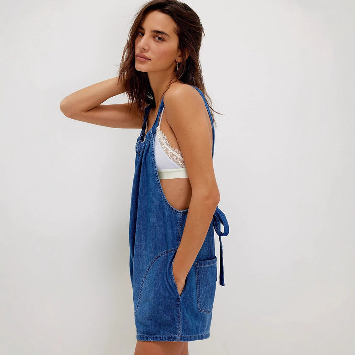 Women's denim jumpsuit with playful cut and adjustable straps