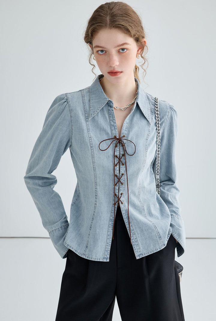Ladies' jeans blouse with playful lacing details and elegant cut