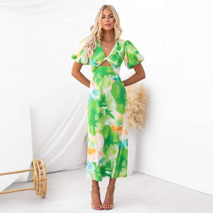 Women's maxi dress with floral accents and an eye-catching cut-out