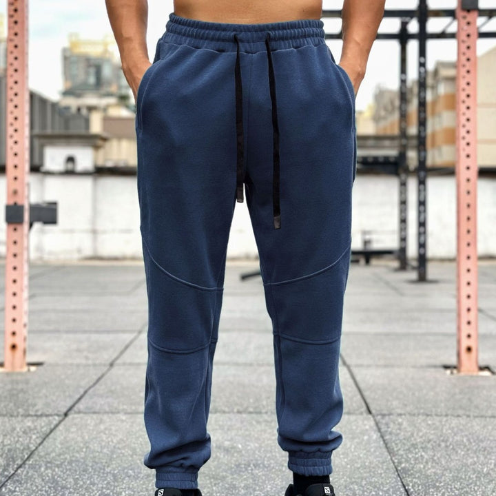 Men's sporty jogging pants with elastic waistband and practical side pockets Lisslune