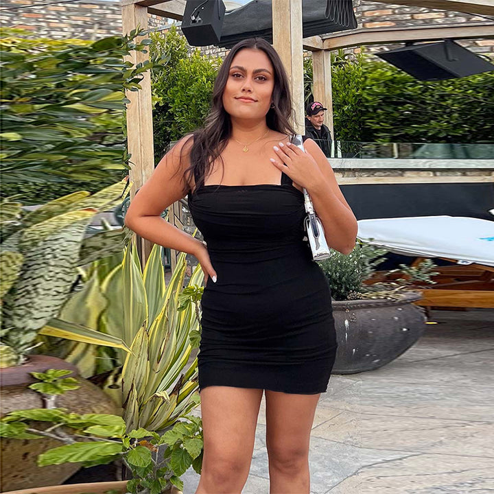 Ladies form-fitting mini dress with sophisticated strap details and subtle ruching