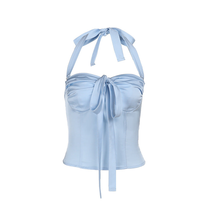 Women's satin top with playful ruffle detail and decorative tie band
