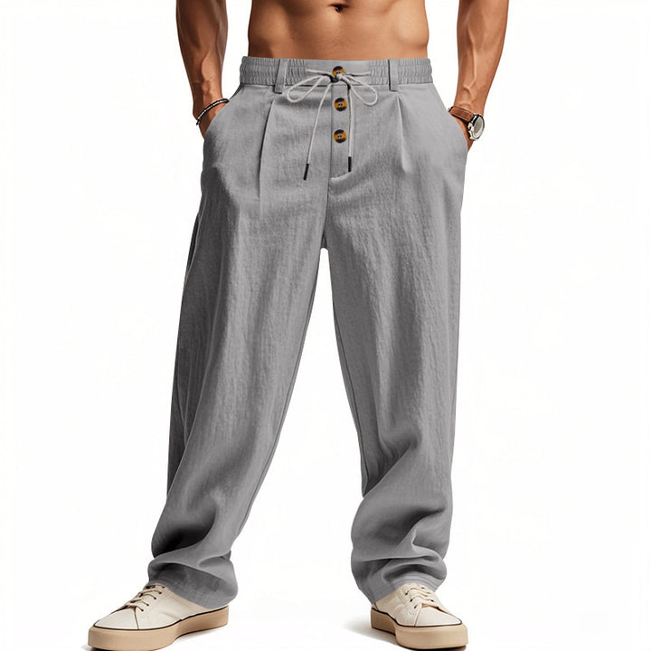 Men's casual loose-fitting leisure pants with elastic waistband and functional button details Lisslune