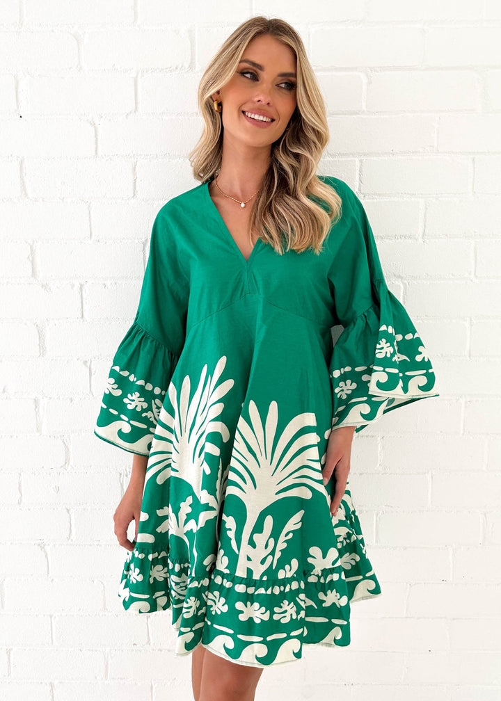 Women's casual dress with voluminous sleeves and structured ruffle details