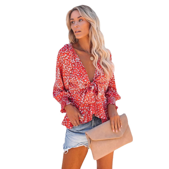 Ladies blouse top with playful floral pattern and elegant knot detail Lune London