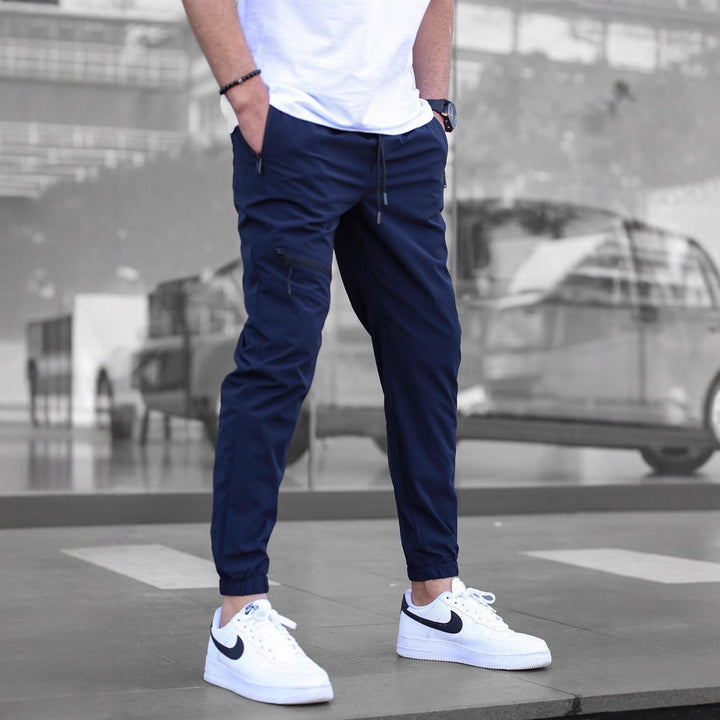 Men's sporty suit pants with elastic waistband and side zip pockets Lisslune