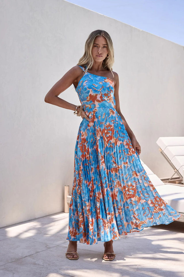 Ladies maxi dress with swinging pleated skirt and feminine floral design