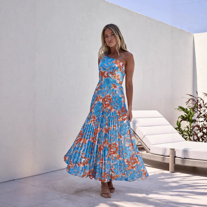 Ladies maxi dress with swinging pleated skirt and feminine floral design