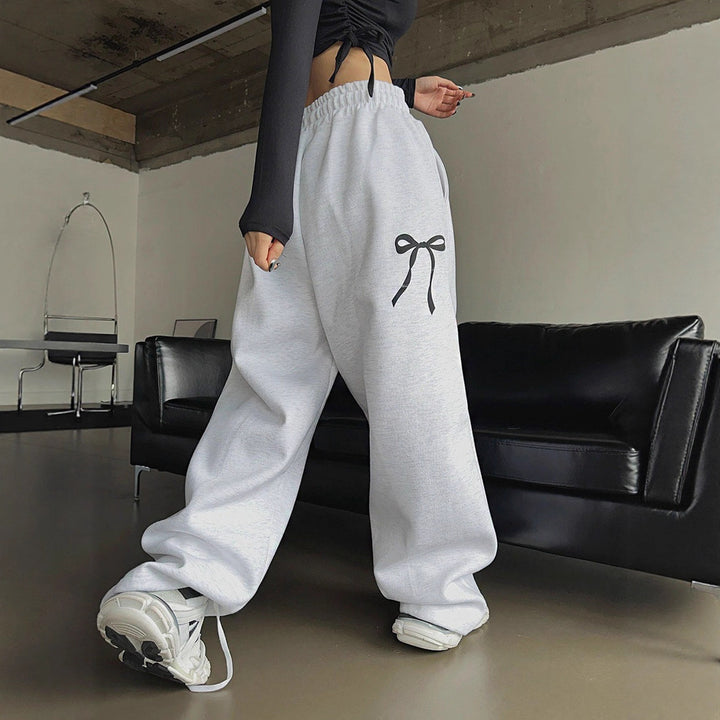Women's loose leisure pants with elastic waistband and decorative bow motif Lisslune