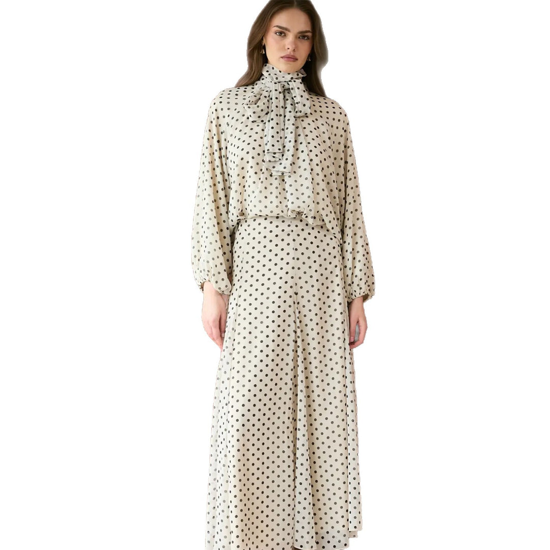 Women’s dress with elegant stand-up collar and playful polka dot design