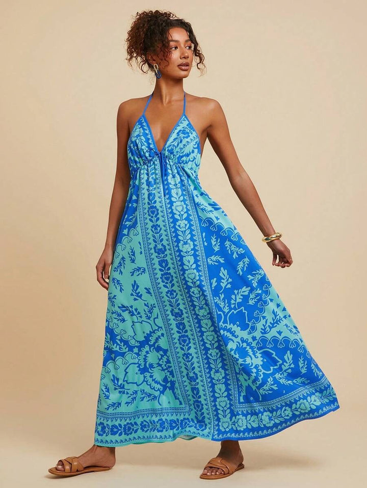 Women's maxi dress with deep V-neckline and floral pattern details Lune London