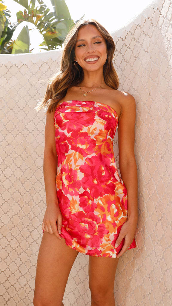 Ladies flirty mini dress in bandeau style with floral accents and swinging hem