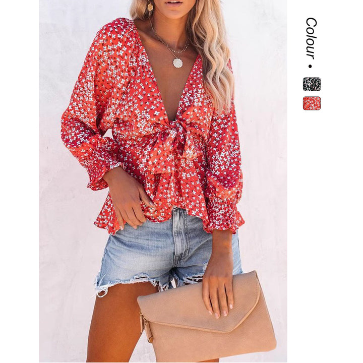 Ladies blouse top with playful floral pattern and elegant knot detail Lune London