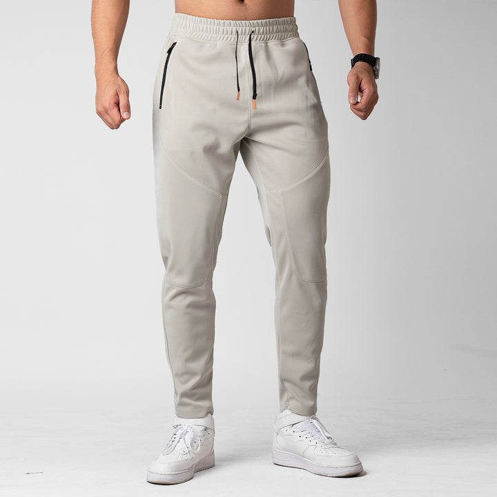 Men's sporty jogging pants with innovative breathable structure and practical zip pockets Lisslune