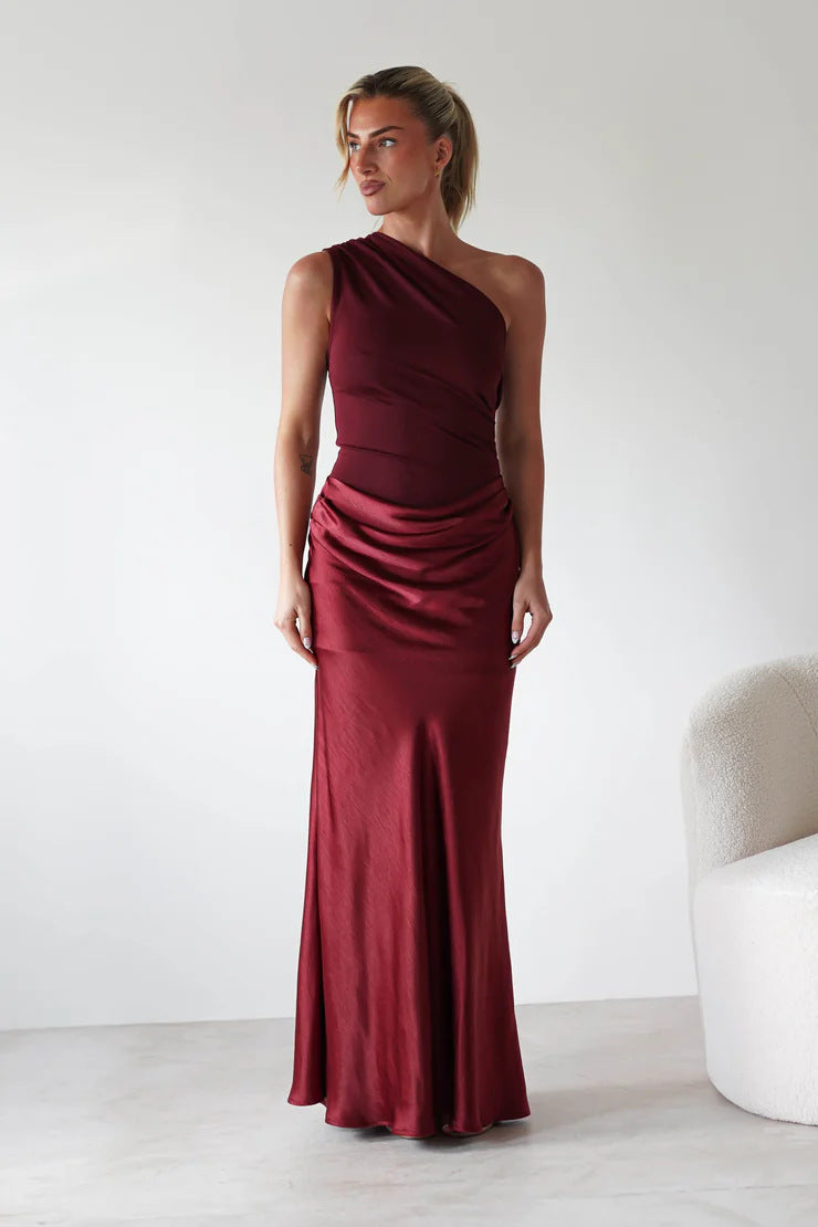 Women’s evening dress with asymmetrical cut and elegant draping design