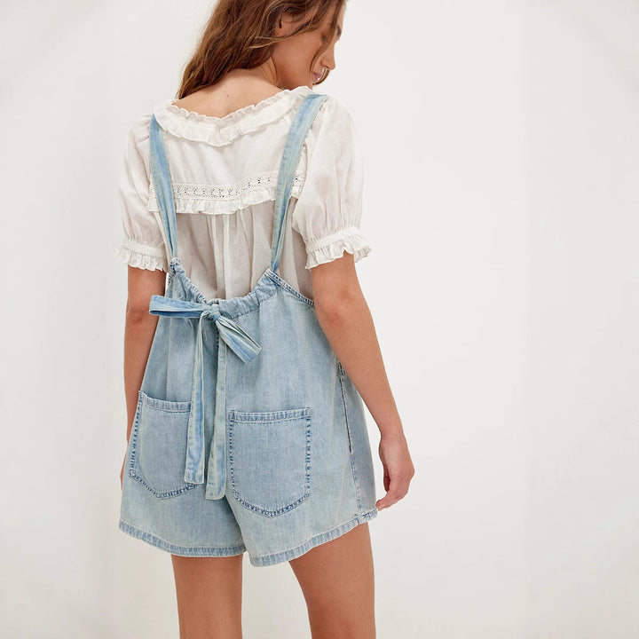 Women's denim jumpsuit with playful cut and adjustable straps