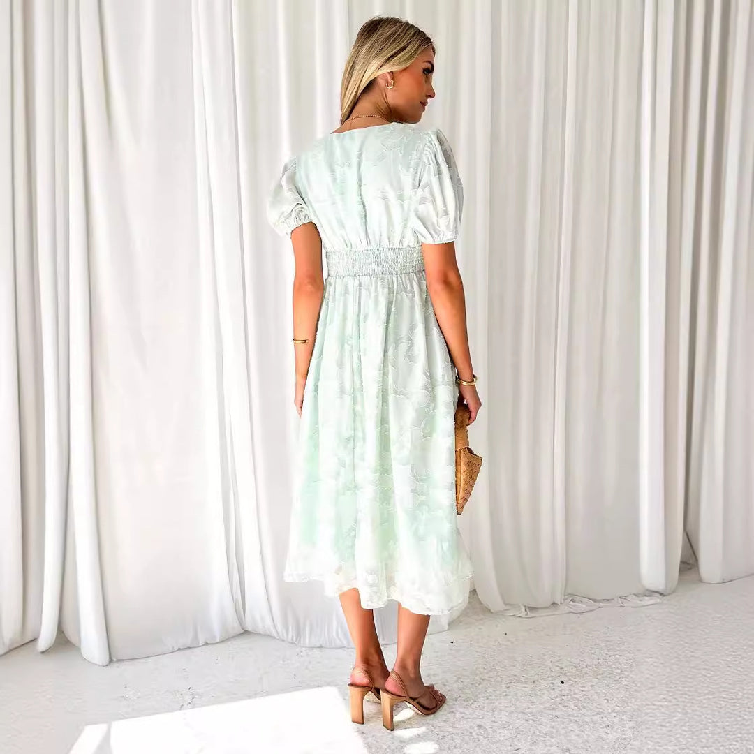 Women's maxi dress with floral accents and voluminous puff sleeves