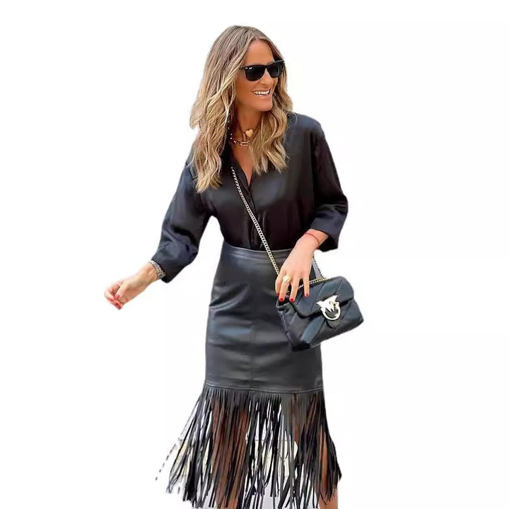 Women's fuchsia fringe skirt made of synthetic leather with a fitted silhouette and swinging design