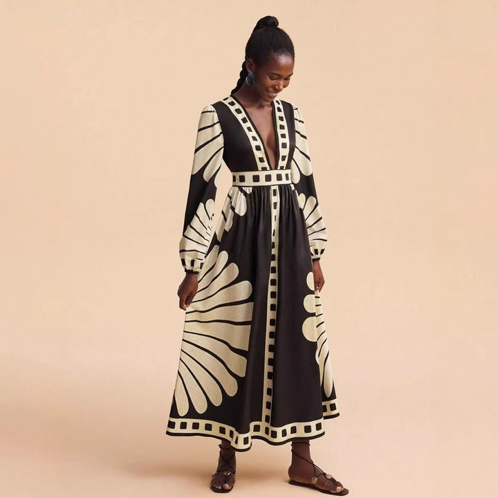 Women's maxi dress with deep V-neck and extravagant sleeve designs Lune London