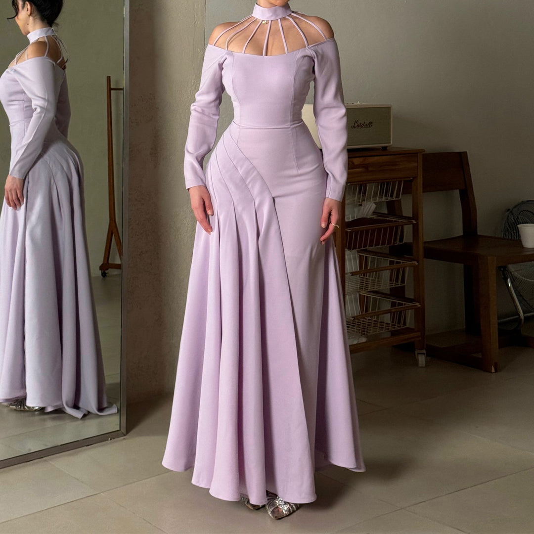 Ladies elegant evening dress with strategic cut-outs and flowing skirt