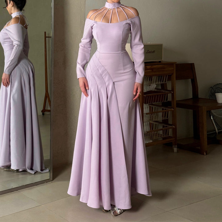 Ladies elegant evening dress with strategic cut-outs and flowing skirt