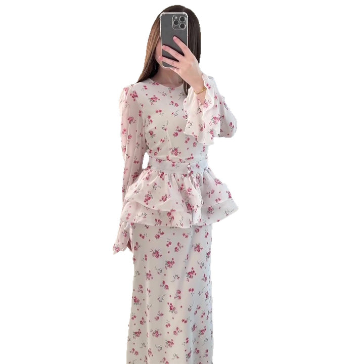 Women's maxi dress with voluminous peplum and floral accents
