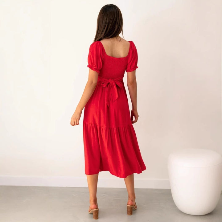 Women's midi dress with playful cut-outs and tie details Lune London